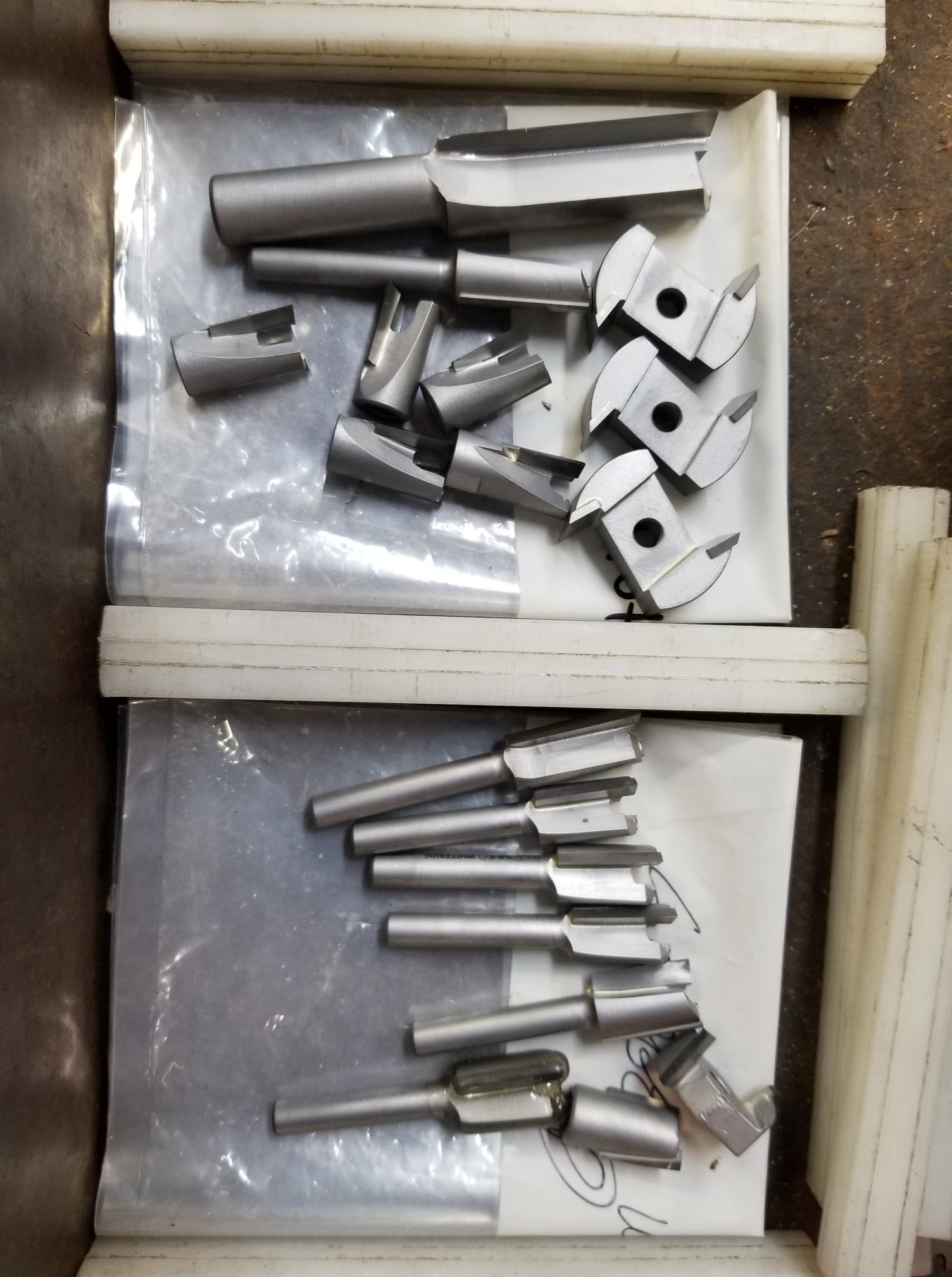 A bunch of pieces of metal are in plastic bags