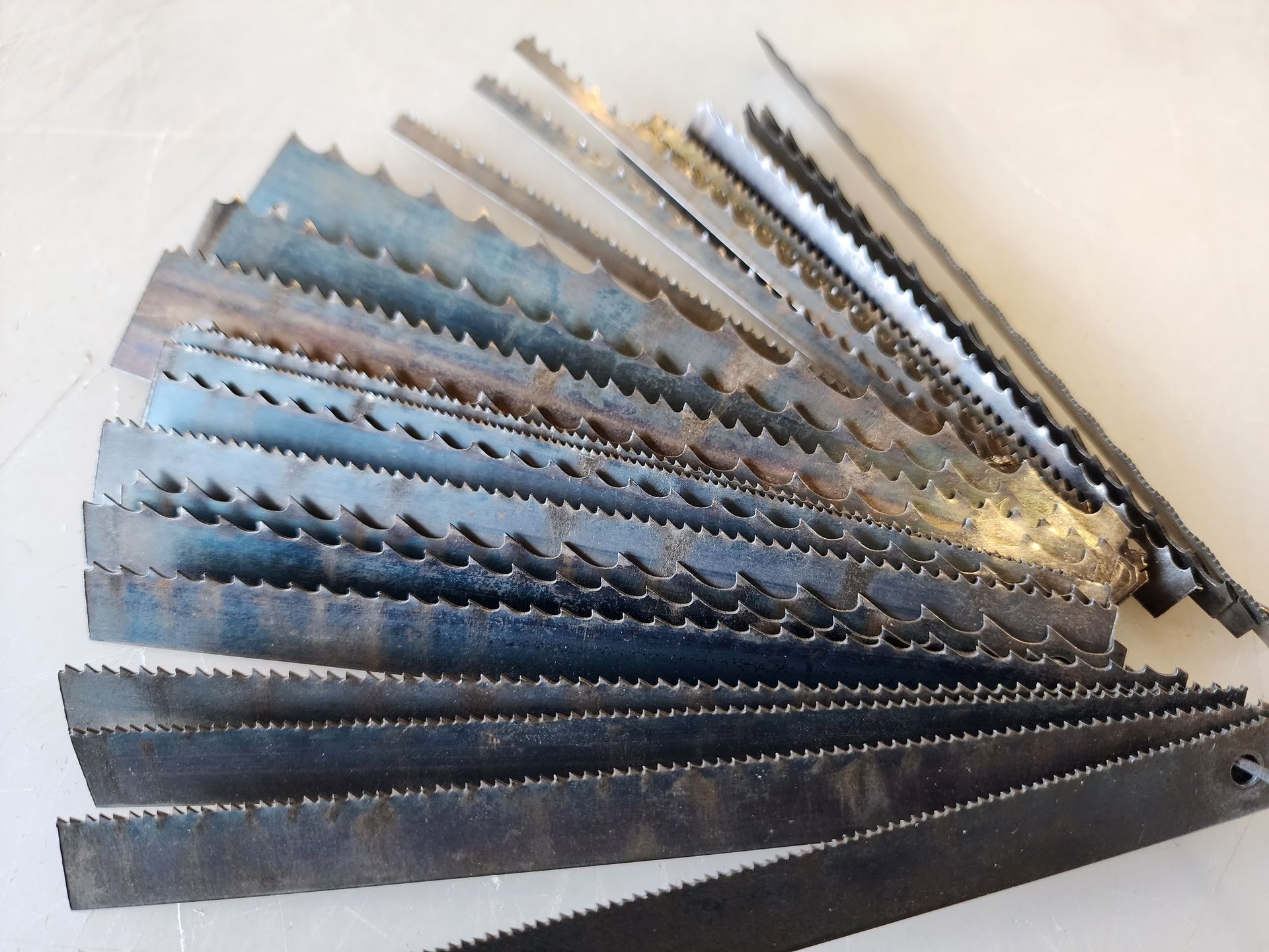 A bunch of different types of saw blades on a table