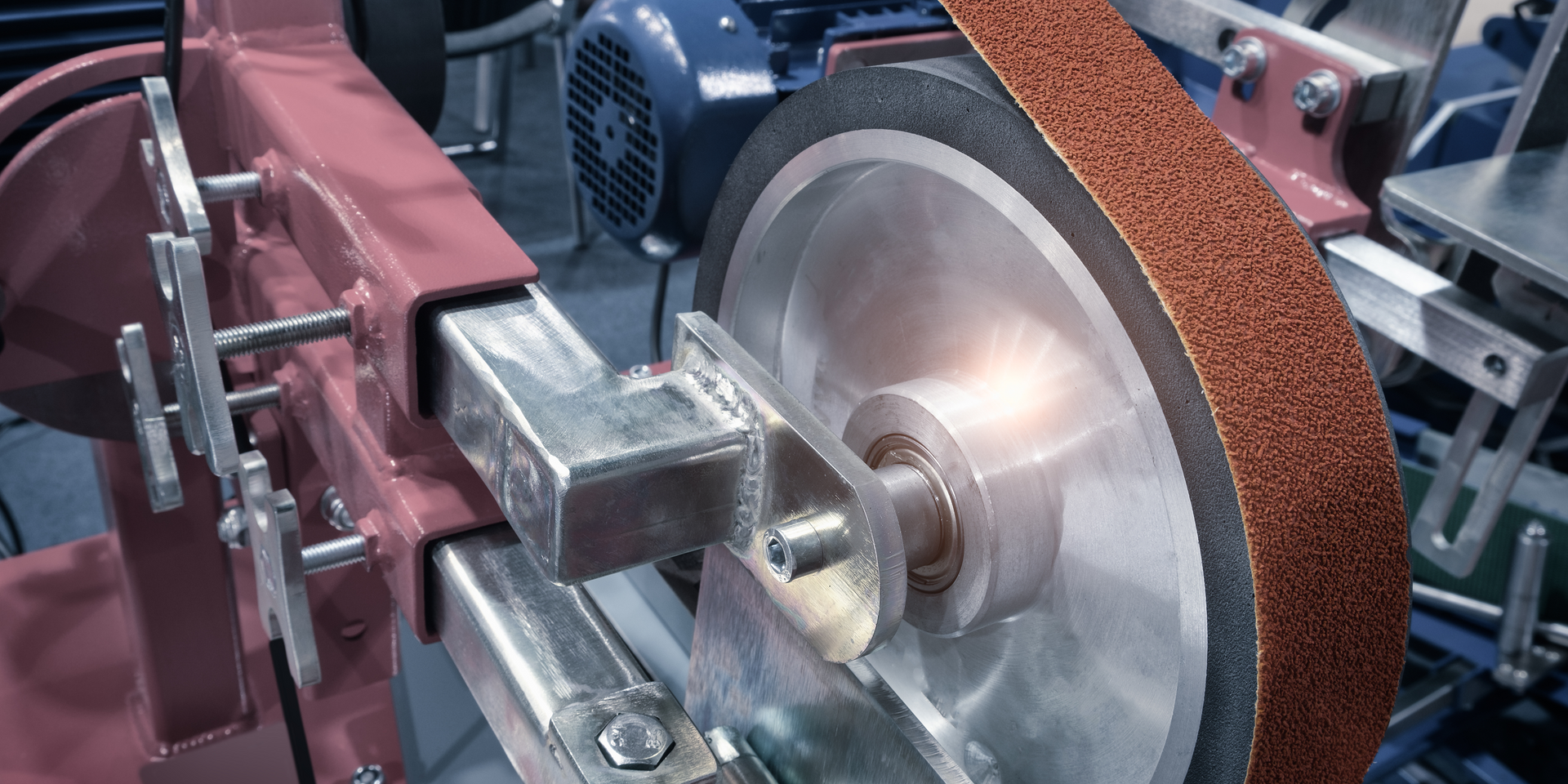 A close up of a machine with a grinding wheel on it.