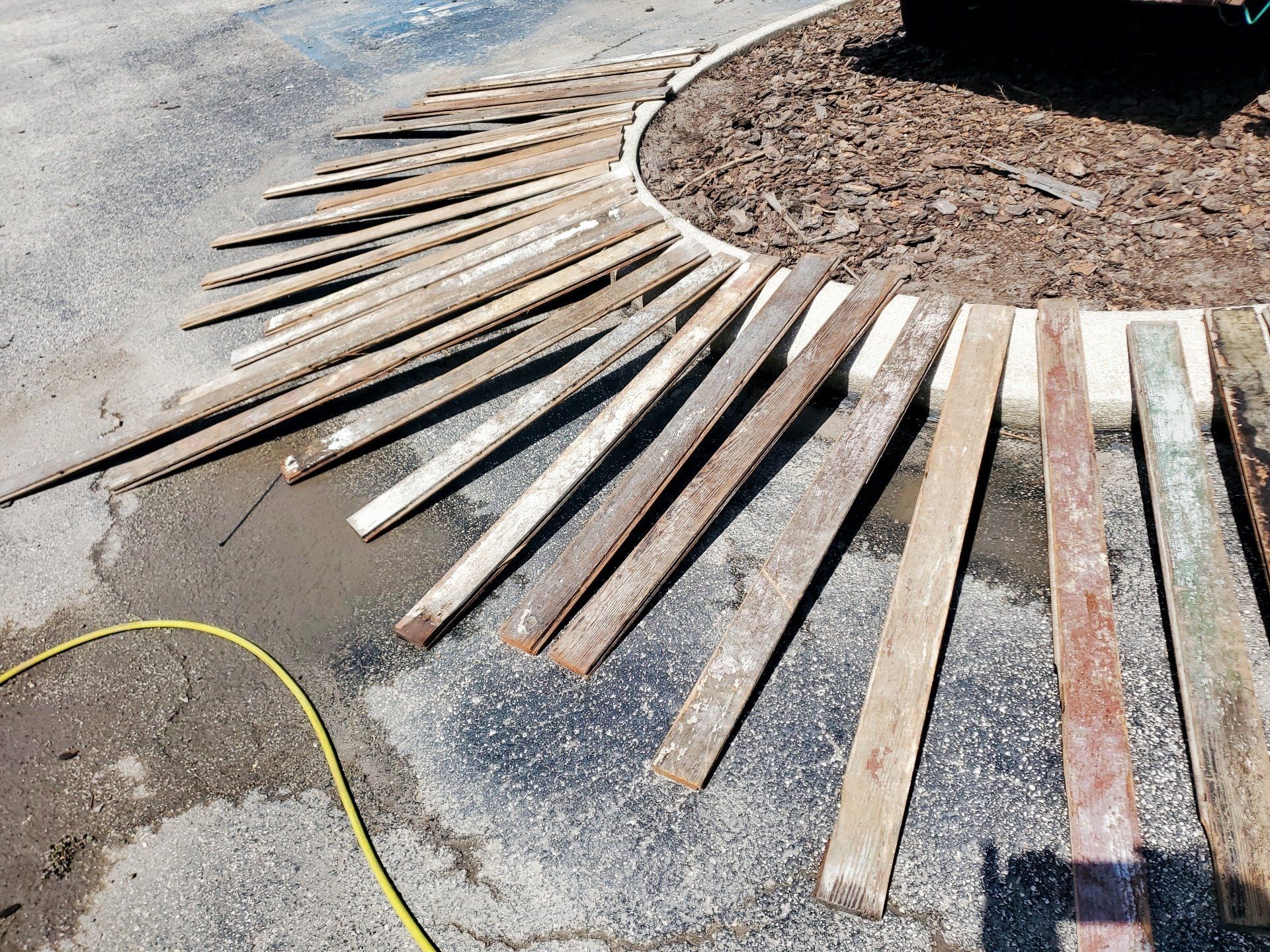 A bunch of wooden sticks are laying on the ground