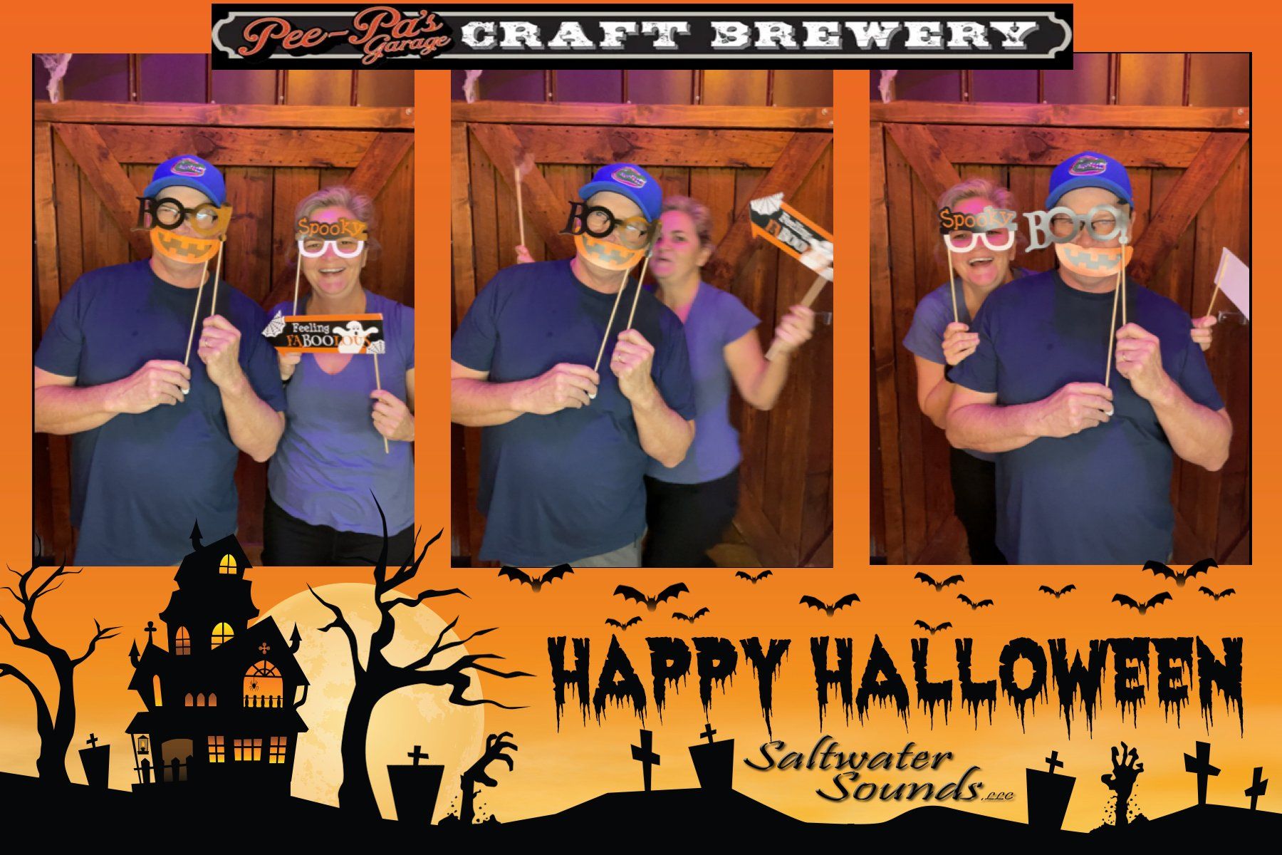A couple posing for a photo in a photo booth that says happy halloween
