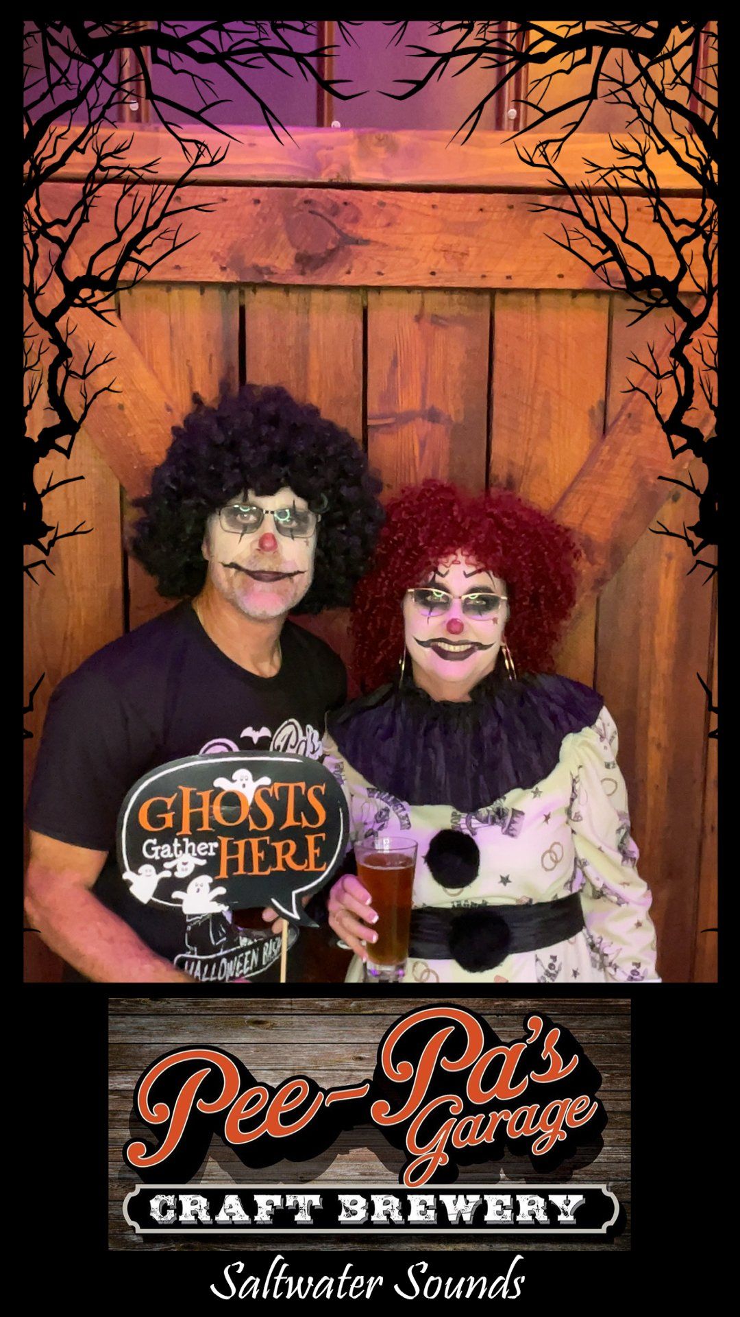 A man and a woman are posing for a picture in a photo booth.