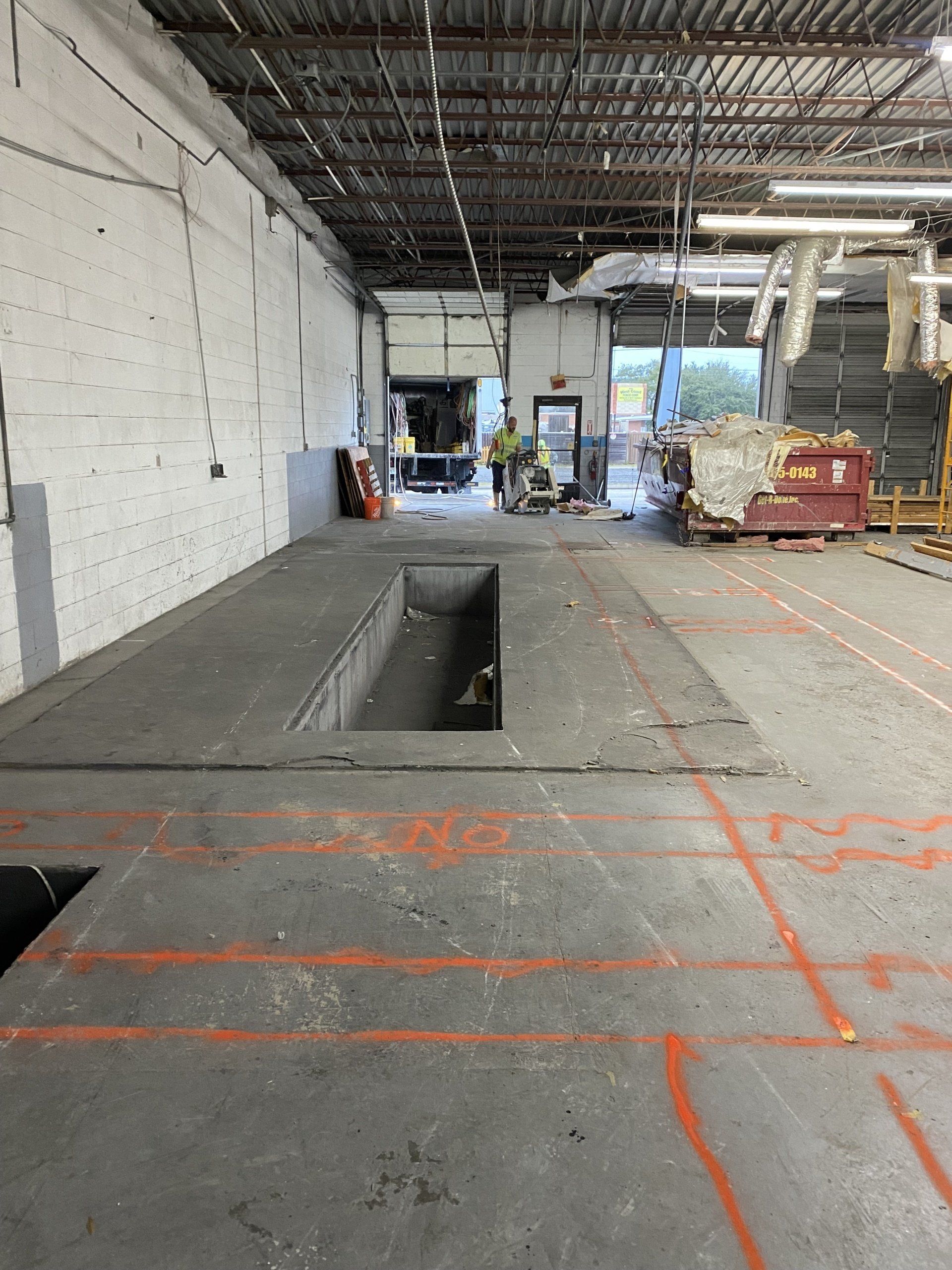 A large warehouse with a large hole in the floor