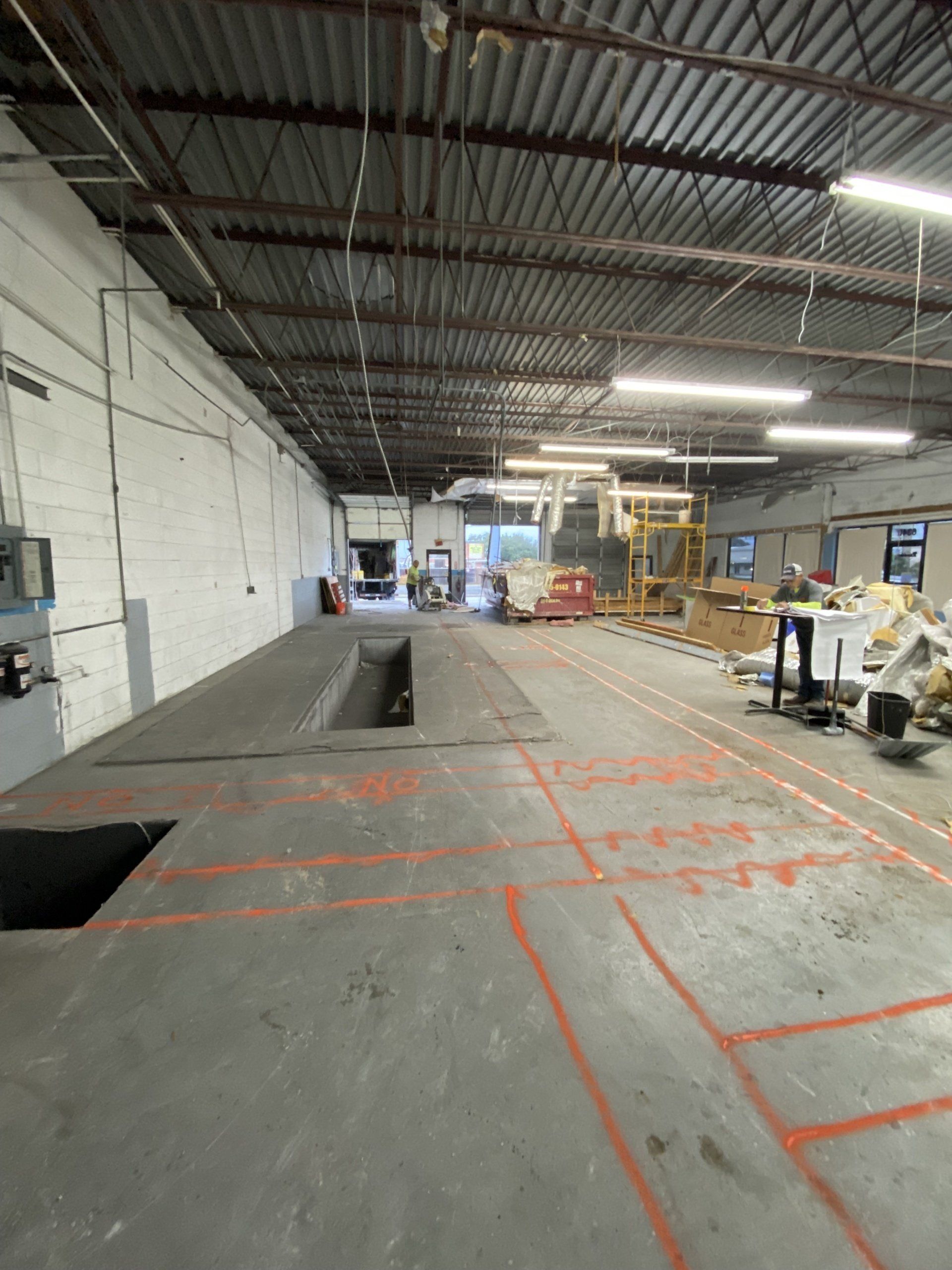 A large warehouse with a lot of machinery in it