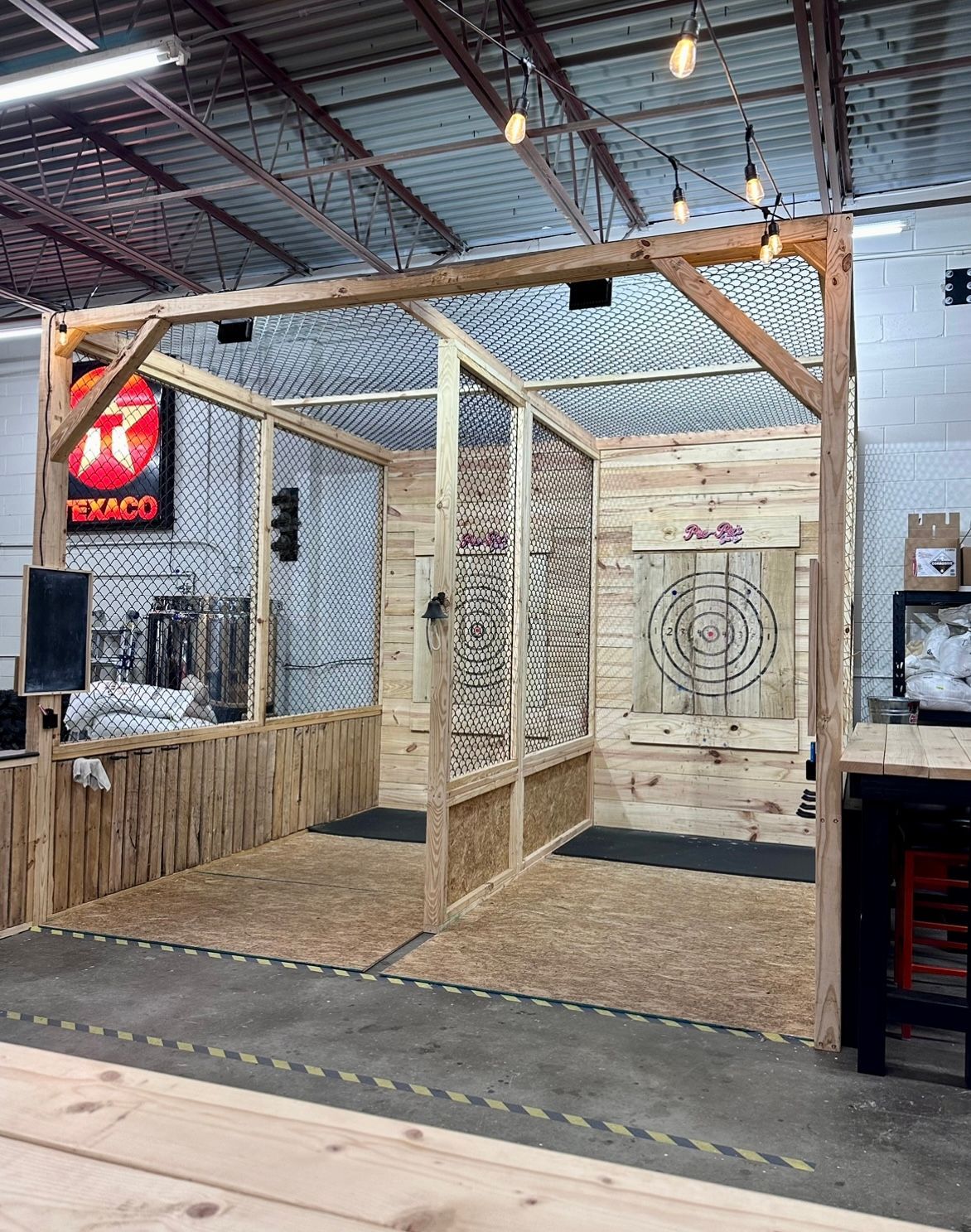A room with two axes in it and a sign that says texaco on it.