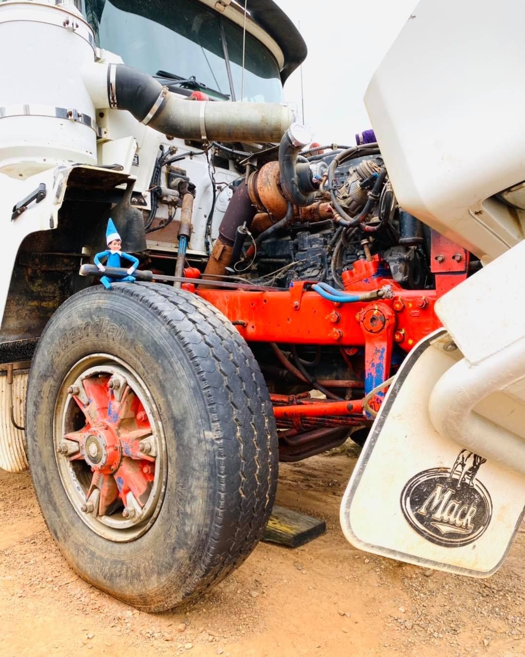 Mack Truck With Open Hood, Tire in Foreground — Traction Diesel Services in Clermont, QLD