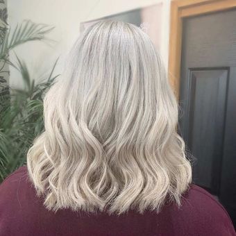 platinum blonde curled hair