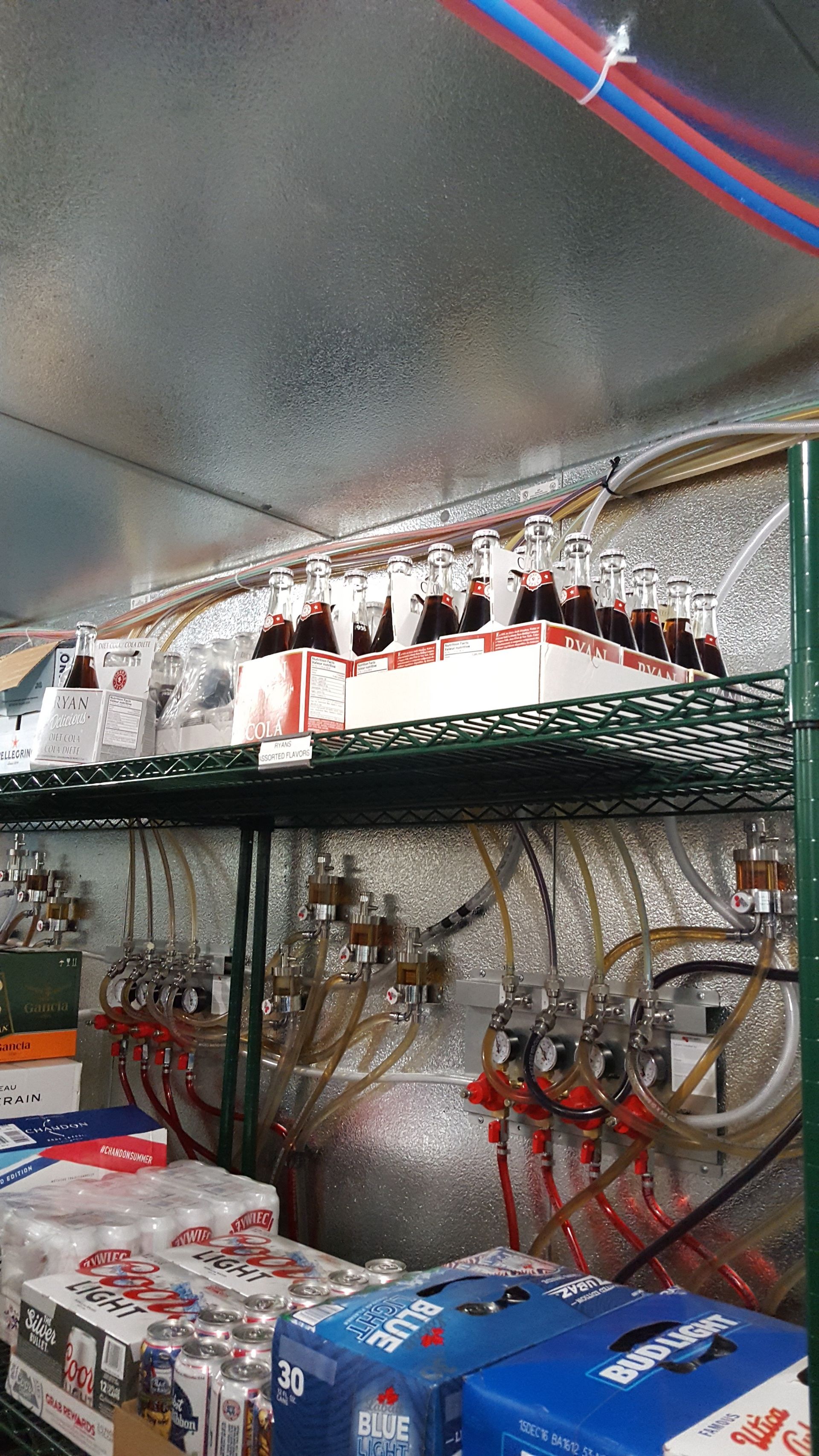 several boxes of beverages sit on a shelf