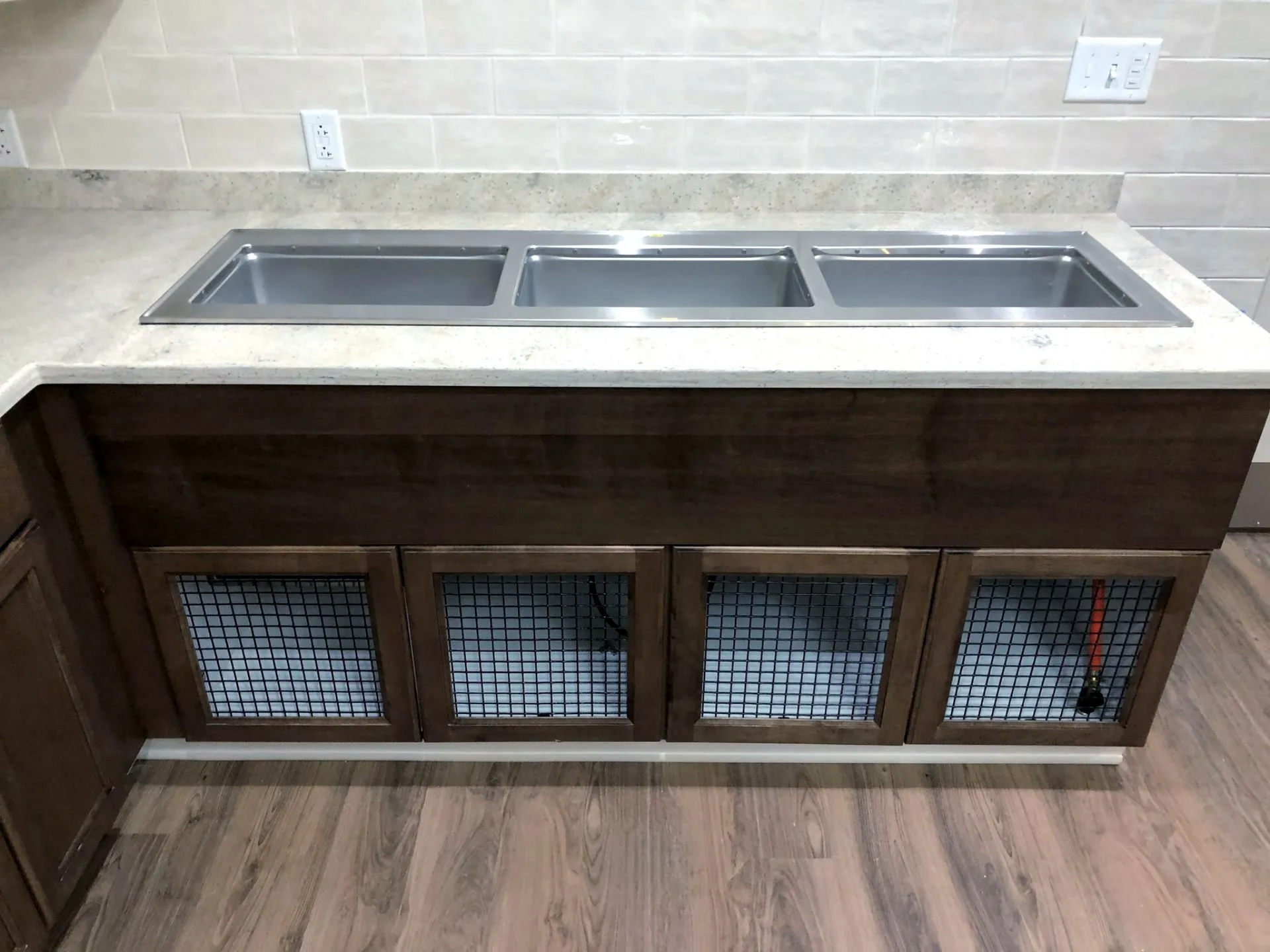 a stainless steel sink in a kitchen