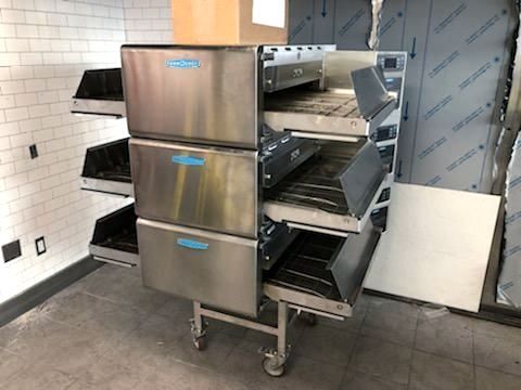 a stainless steel pizza ovens stacked on top of each other