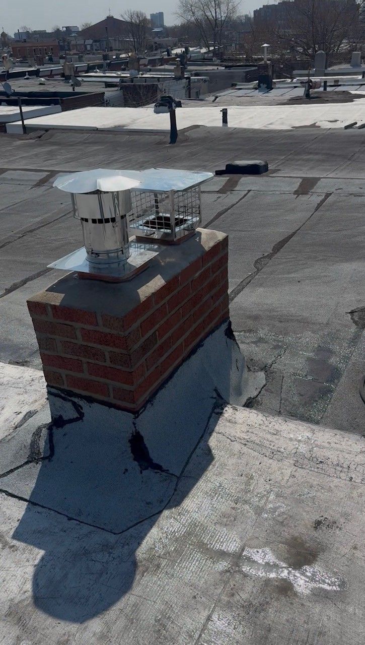 A chimney with a hose attached to it is being worked on