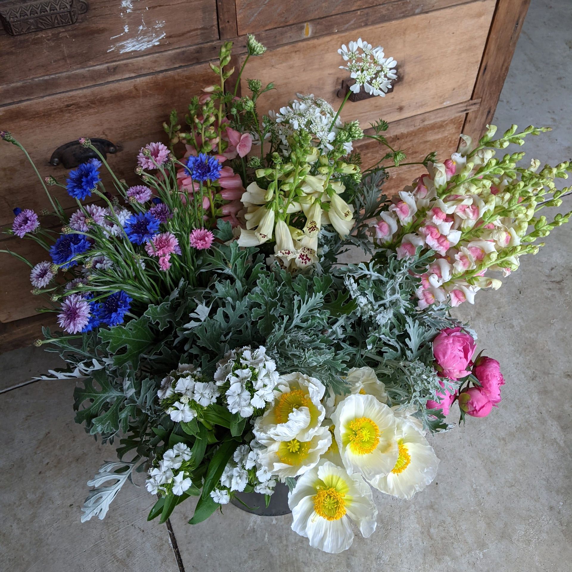 Our DIY buckets contain a season mix of flowers locally grown in Lancaster Ohio