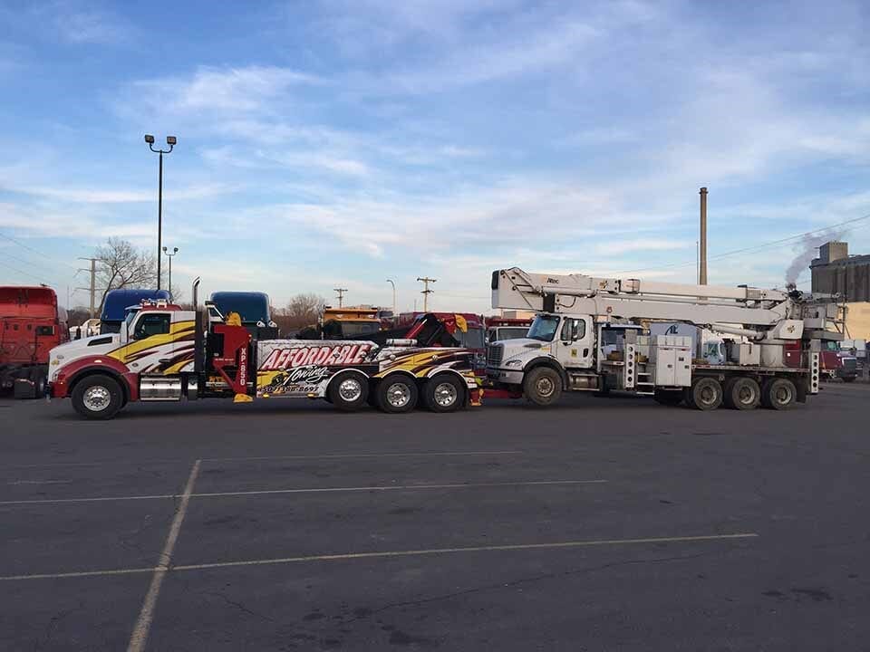 Affordable truck pulling a truck — Construction Equipment Transport in Mankato, MN