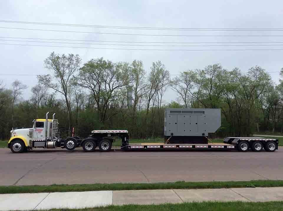 Heavy generator on back of semi — Construction Equipment Transport in Mankato, MN