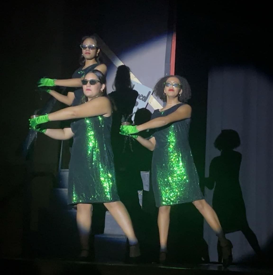 3 performers in a theatrical performance