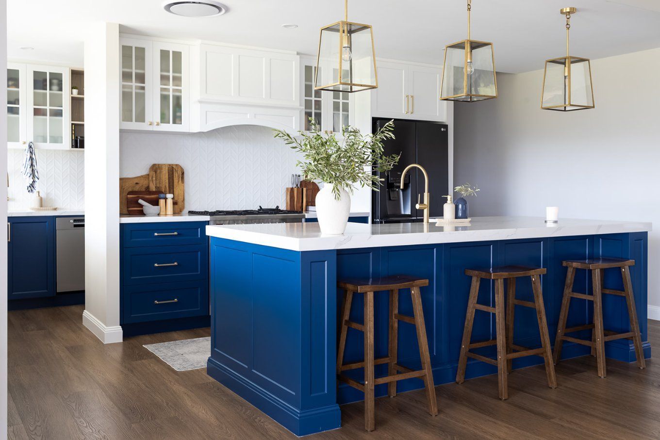 A Modern Kitchen With a Navy Blue Island, White Countertops — Truline Cabinets In Tuchekoi, QLD