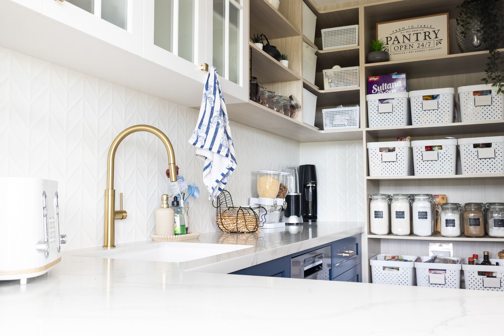 A Blue Kitchen With Two Wooden Bar Stools — Truline Cabinets In Tuchekoi, QLD