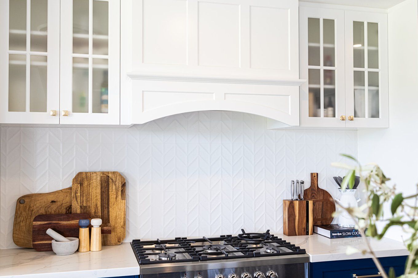 White Kitchen With Blue Cabinets, Stainless Steel Range, and Wooden Cutting Boards on the Counter — Truline Cabinets In Tuchekoi, QLD