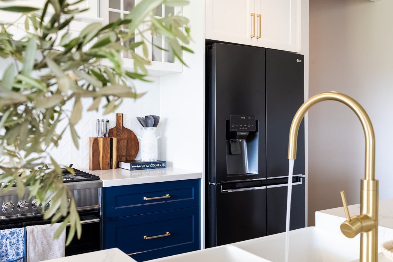 Kitchen With Navy Blue Cabinets, White Countertops, and a Black Refrigerator — Truline Cabinets In Tuchekoi, QLD