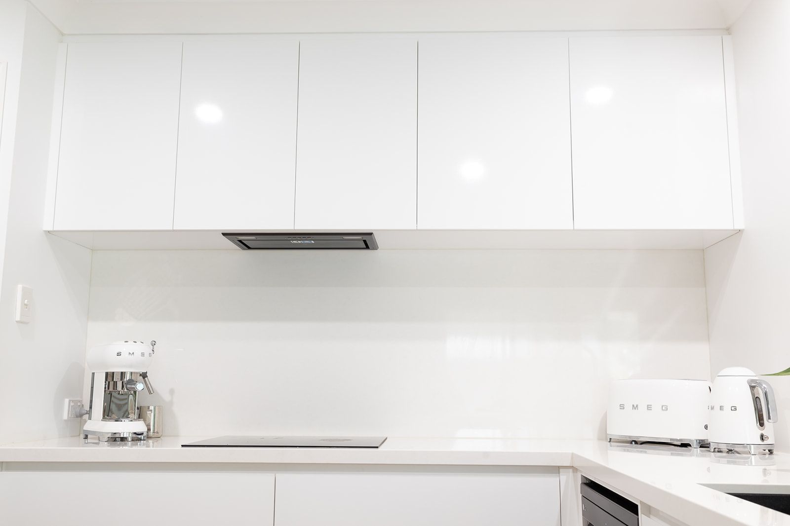 White Modern Kitchen With Cabinets, Backsplash, and Appliances — Truline Cabinets In Tuchekoi, QLD