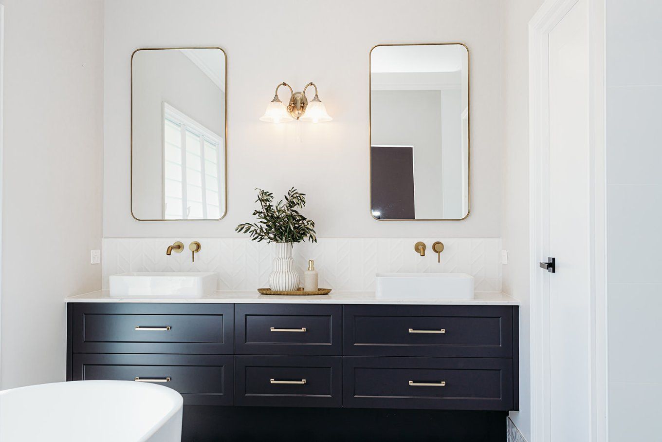 Modern Bathroom With a Dark Blue Vanity, White Countertops, Rectangular Gold-framed Mirrors, and Gold Fixtures — Truline Cabinets In Tuchekoi, QLD