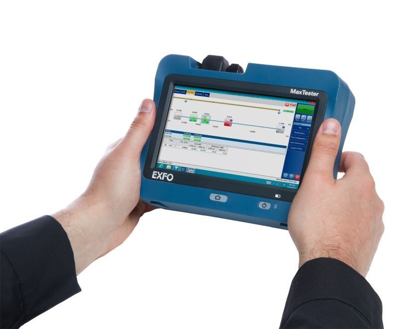 A person is holding a capo device in their hands