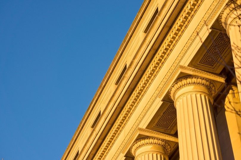 Government building against blue sky where NTI fiber and data center infrastructure allows reliable data sharing