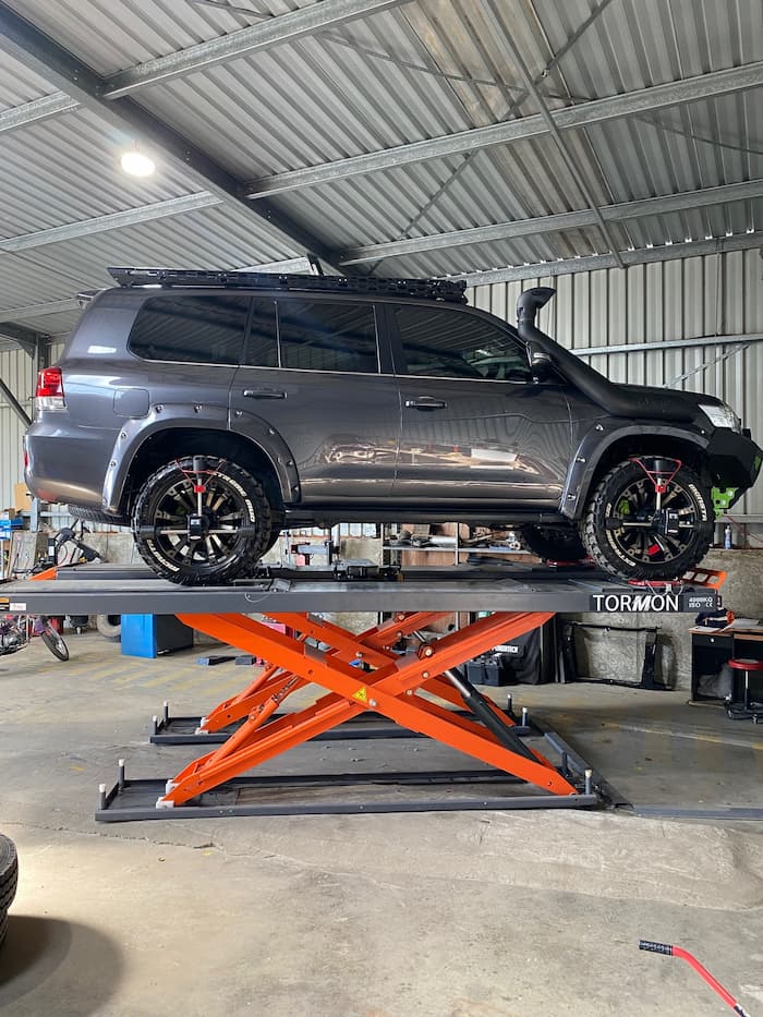 Vehicle on Car Lift in Workshop — Wheel and Tyre Services in Inverell, NSW