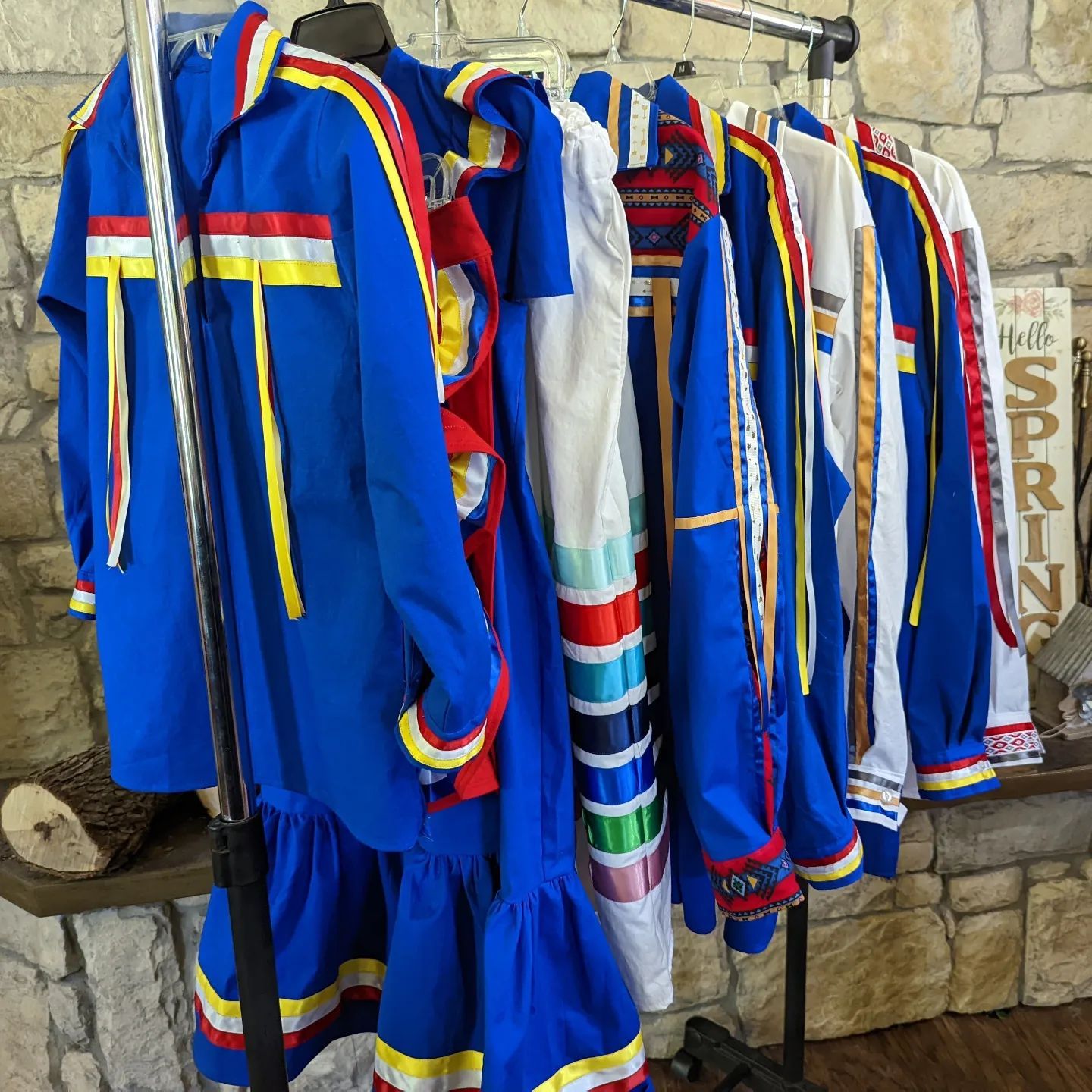The Regalia sirts main color blue are hanging on a rack