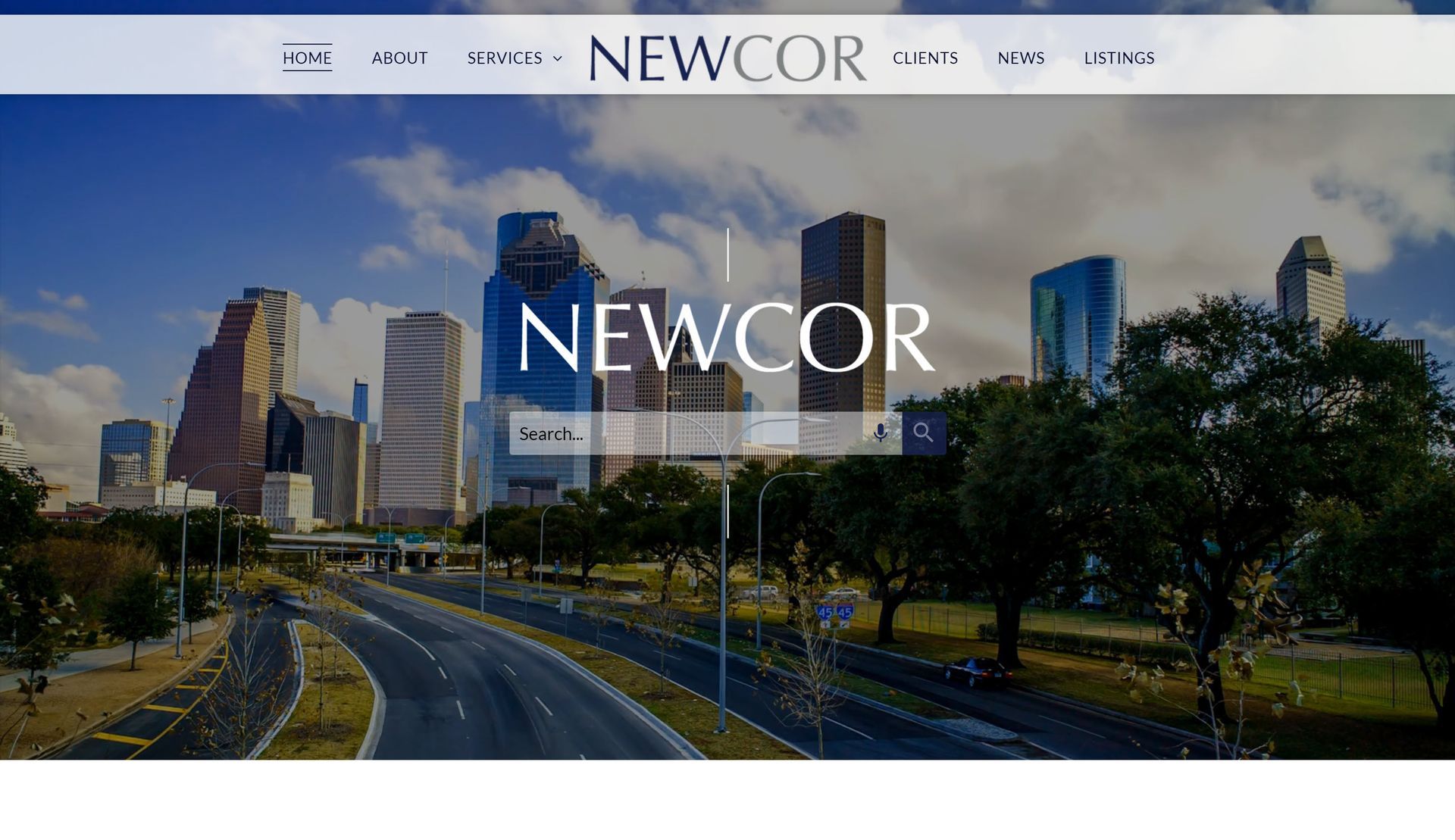 A screenshot of the newcor website with a city skyline in the background.