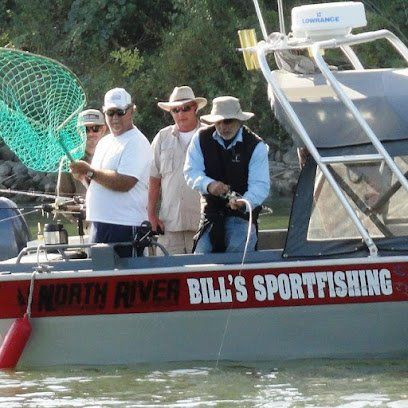 A group of men on a boat that says north river bill 's sportfishing
