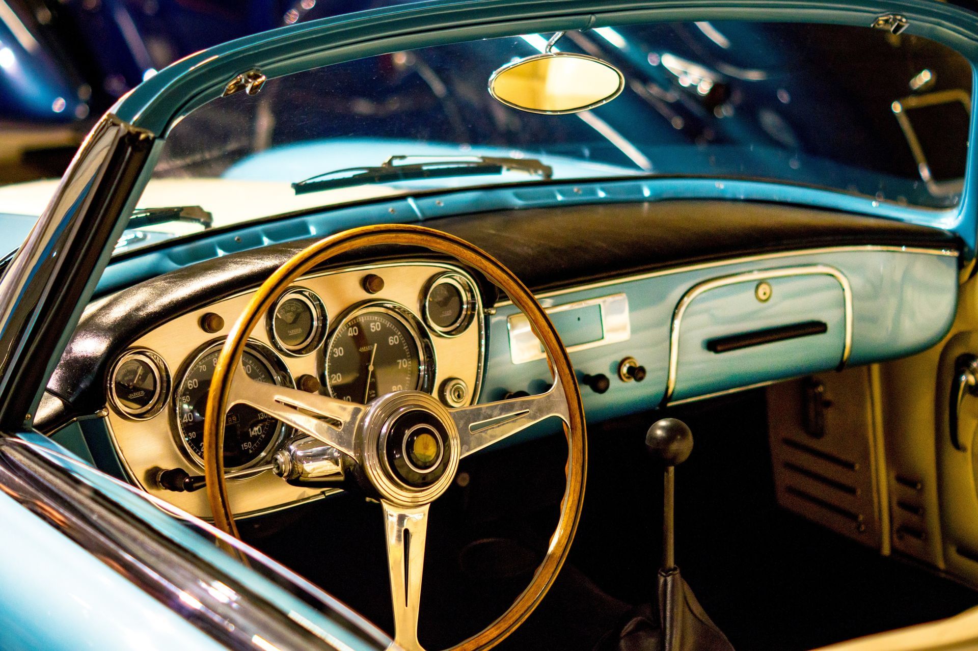 A blue car with a wooden steering wheel