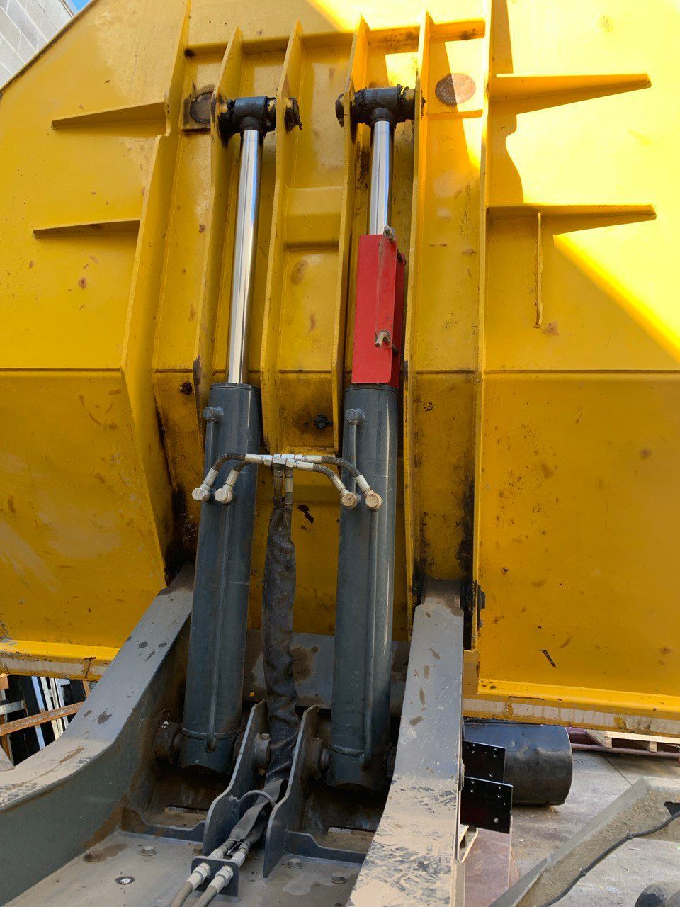 A Yellow Vehicle With a Red Cylinder in the Middle — Hydrofit Service in Wollongong, NSW