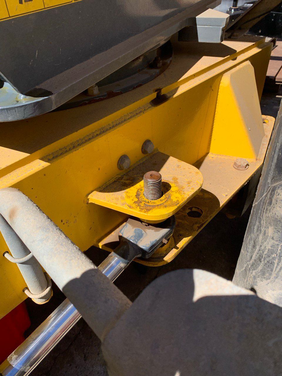 A Close Up of a Yellow Vehicle With a Screw in It — Hydrofit Service in Wollongong, NSW