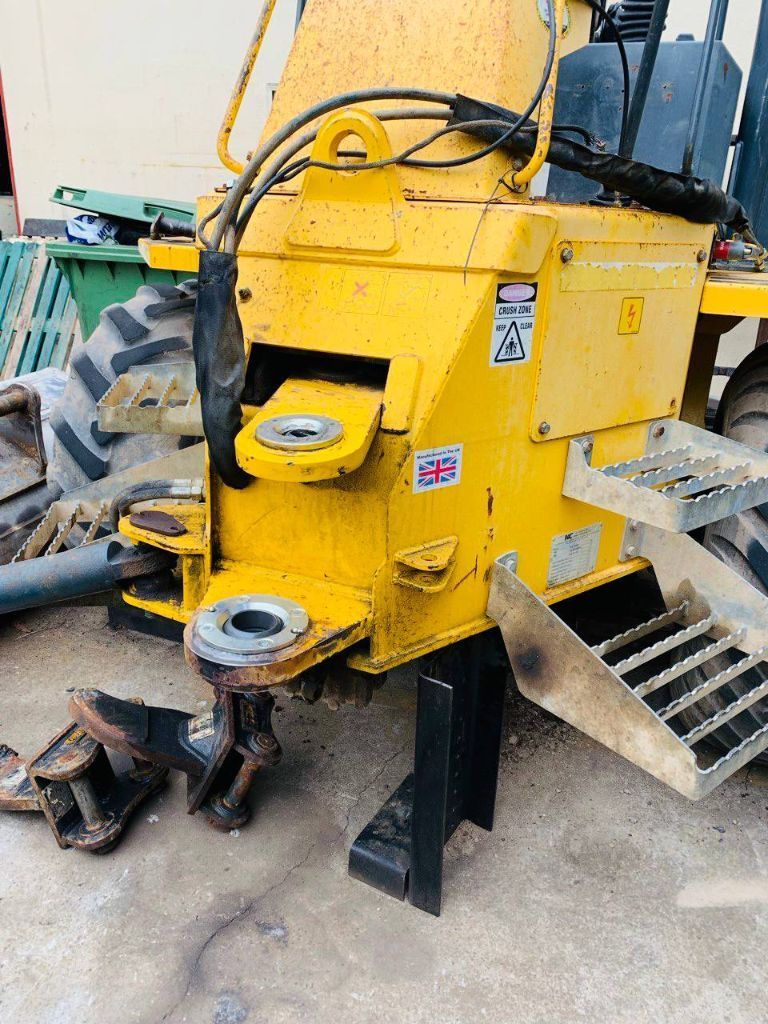 A Yellow Tractor With a Ladder Attached to It is Parked on the Ground — Hydrofit Service in Shellharbour, NSW