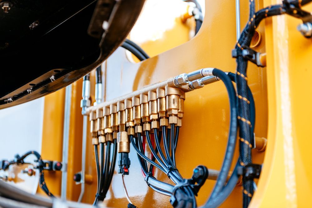 A Close Up of a Yellow Machine With a Bunch of Wires Coming Out of It — Hydrofit Service in Campbelltown, NSW