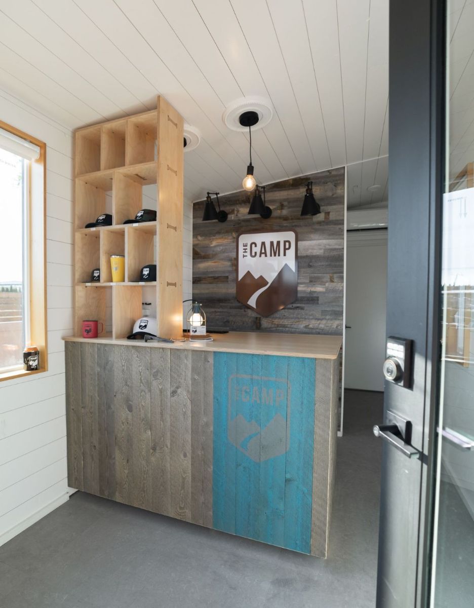 a wooden counter with a sign that says camp on it