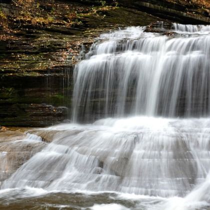 A waterfall with a lot of water coming down it