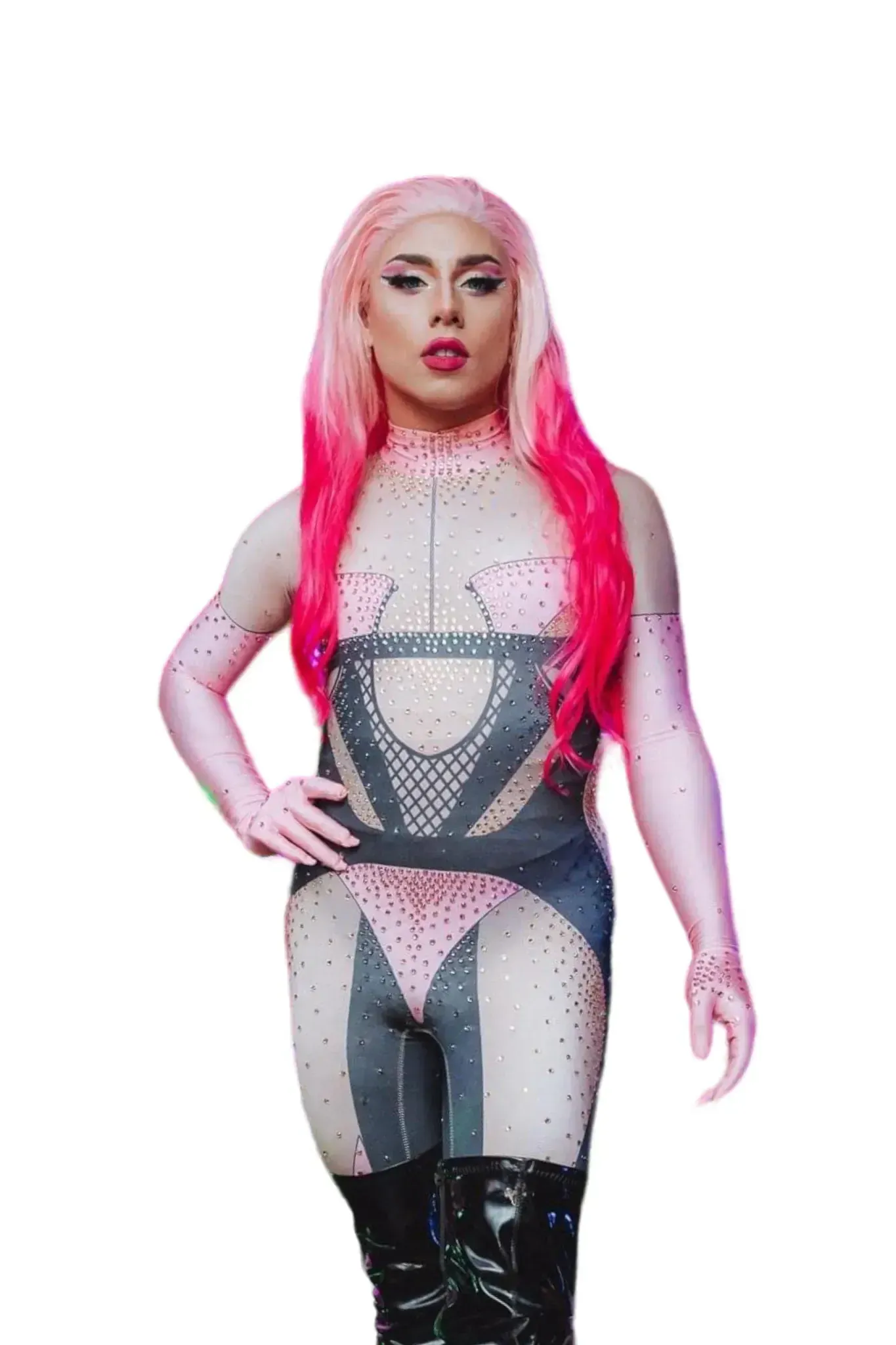 Drag performer in pink and gray bejeweled bodysuit, pink wig, black boots, posing.