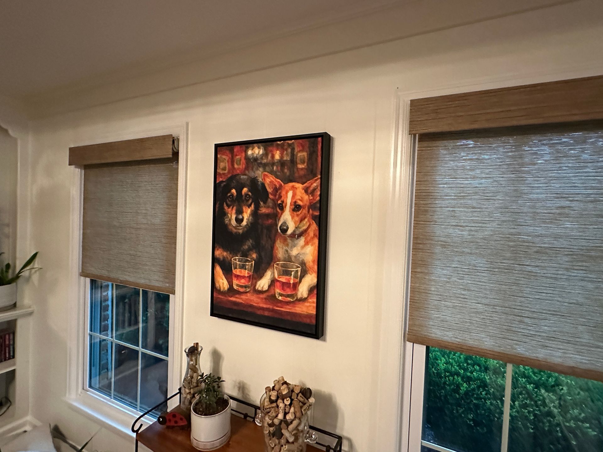 Closed sign on a glass window of a building with a stone wall below.