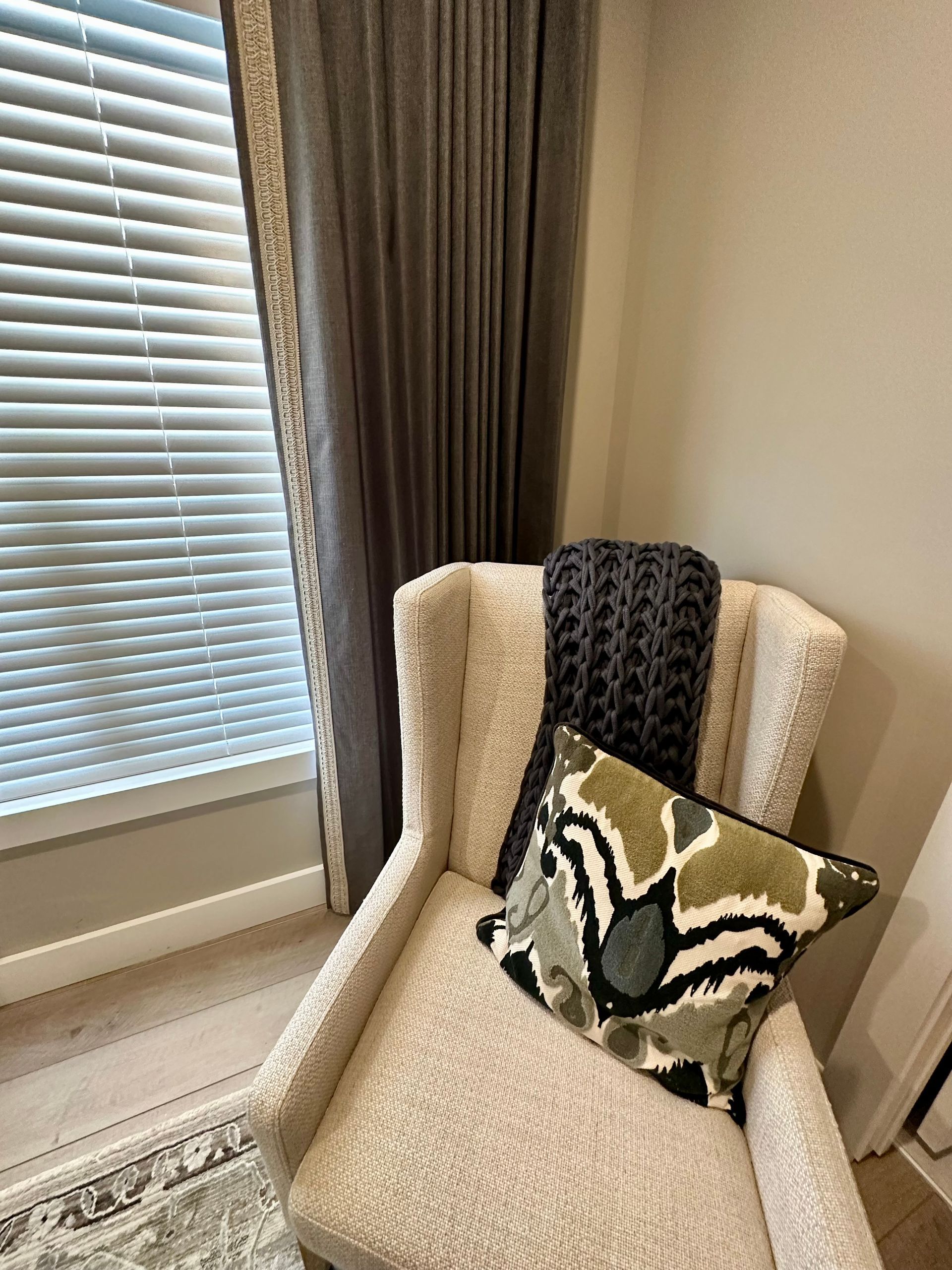 A chair in a corner by a window with faux wood blinds - window fashions on wheels, kentucky