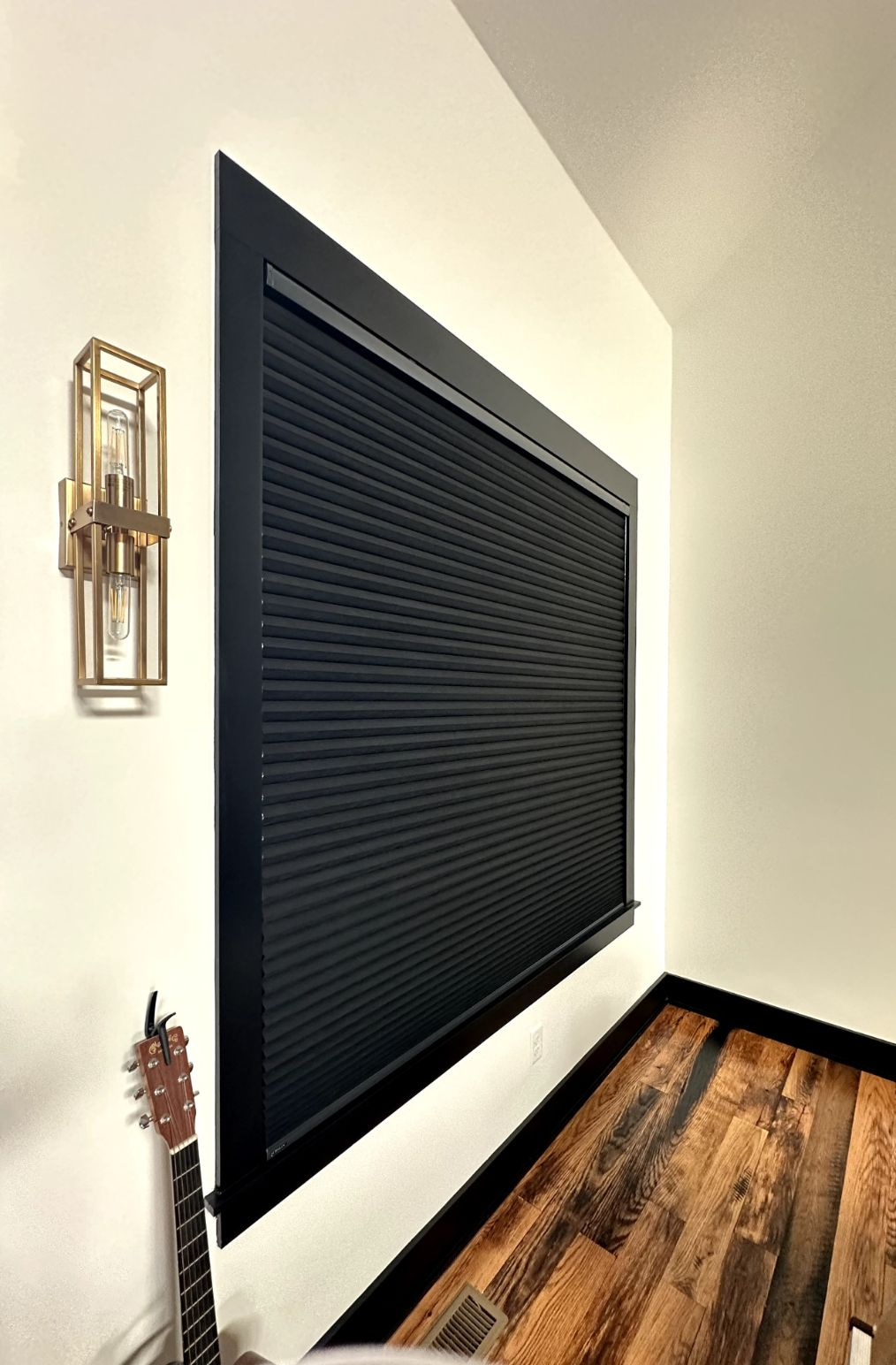A bright room has black honeycomb cellular shades to accent the decor - window fashions on wheels, ky
