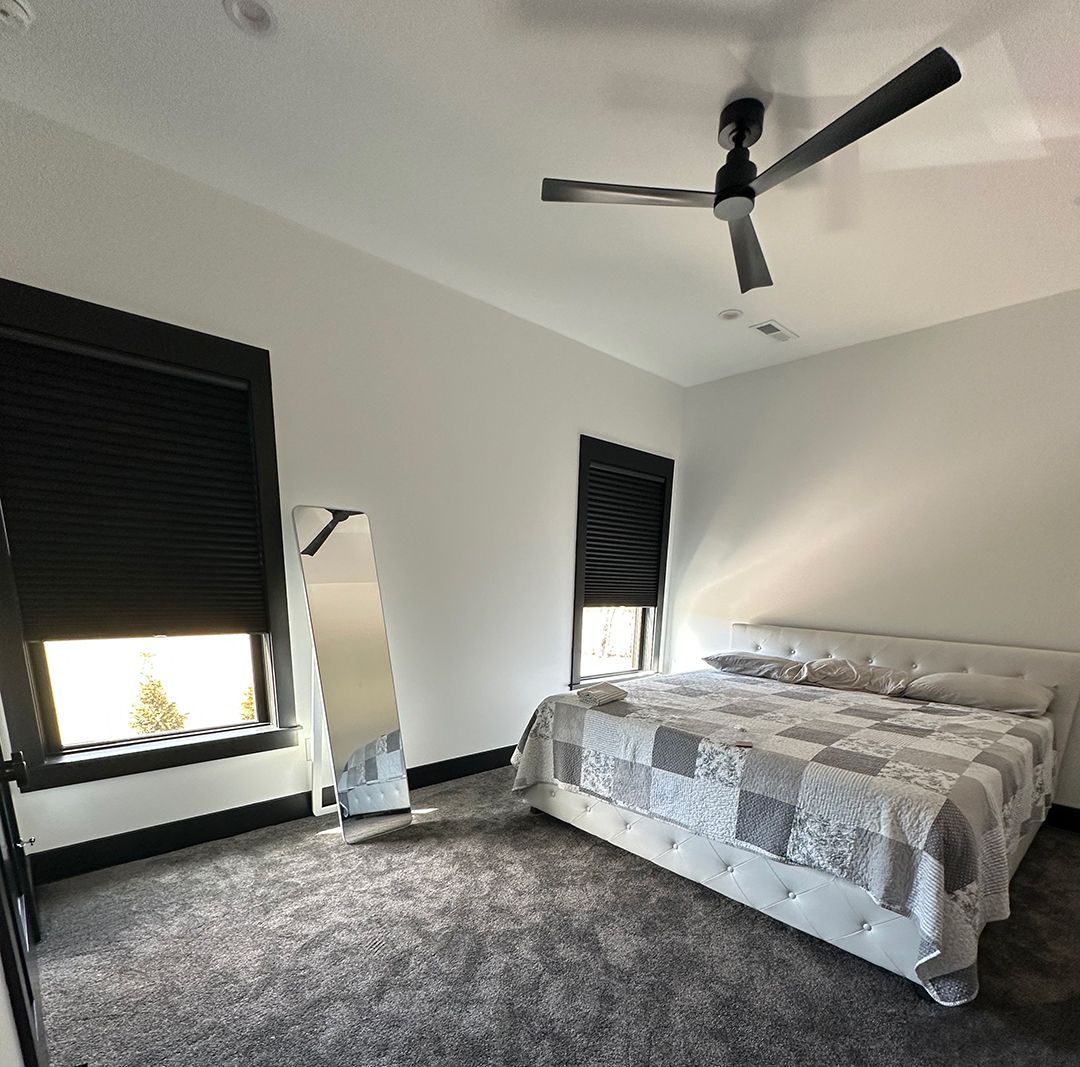 Different window treatments shown in various rooms of a Louisville home.
