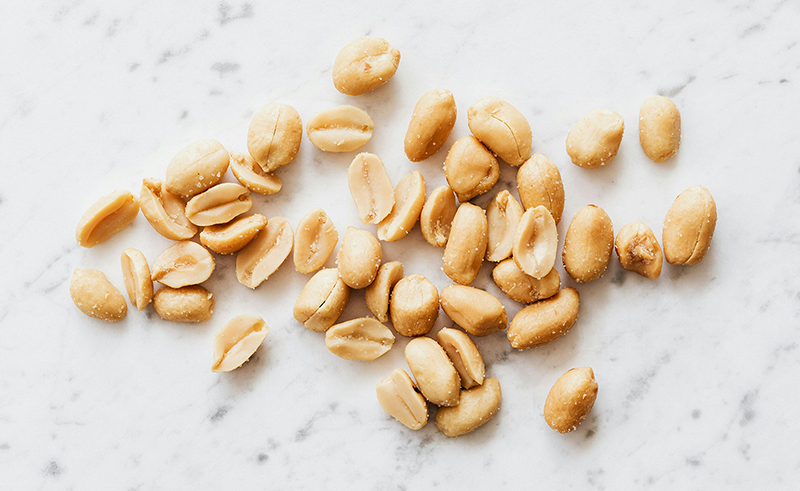 Peanuts on a white table