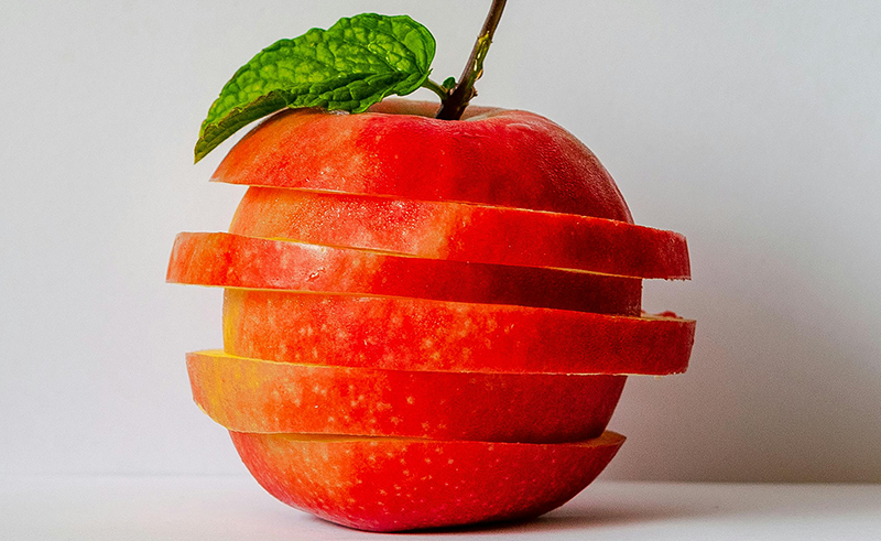 Apple sliced into 6 sections horizontally then restacked