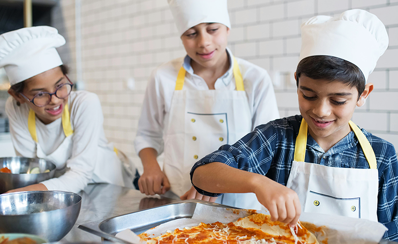 Students learning how to cook