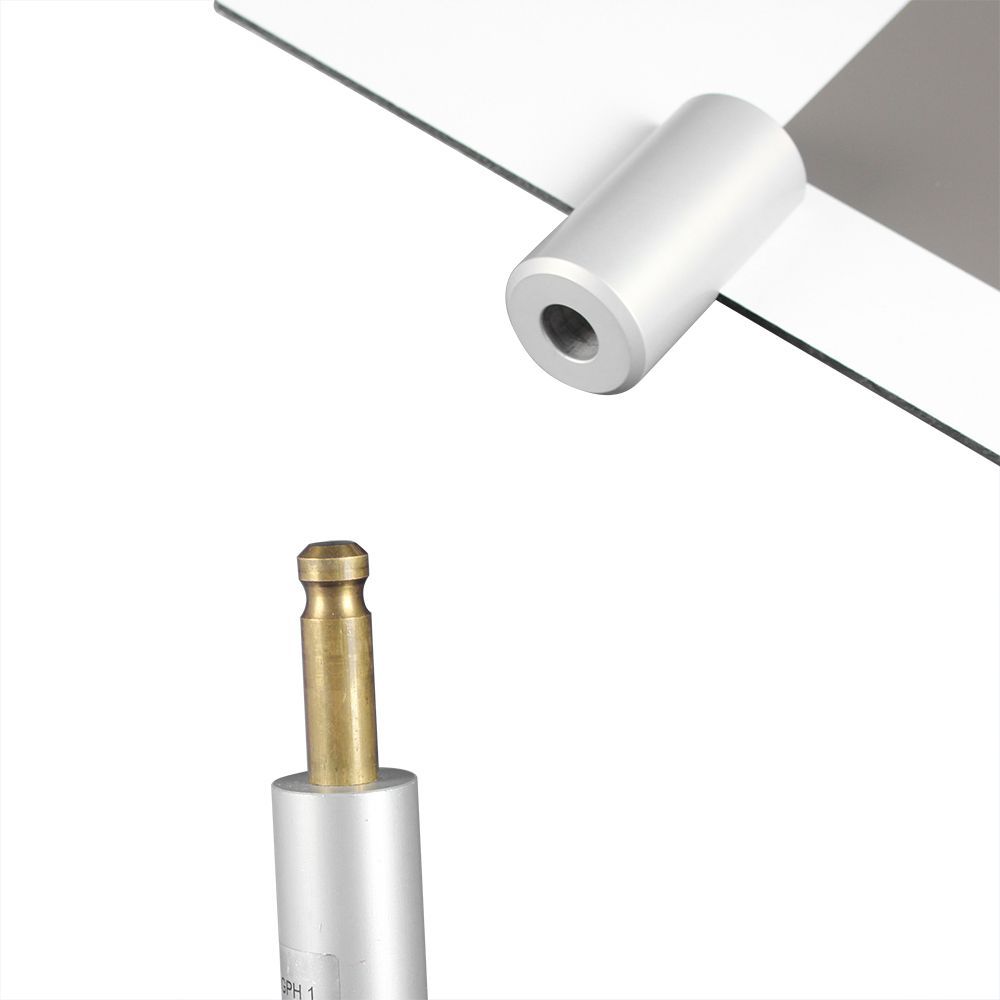 A black and white checkered board with a camera attached to it.