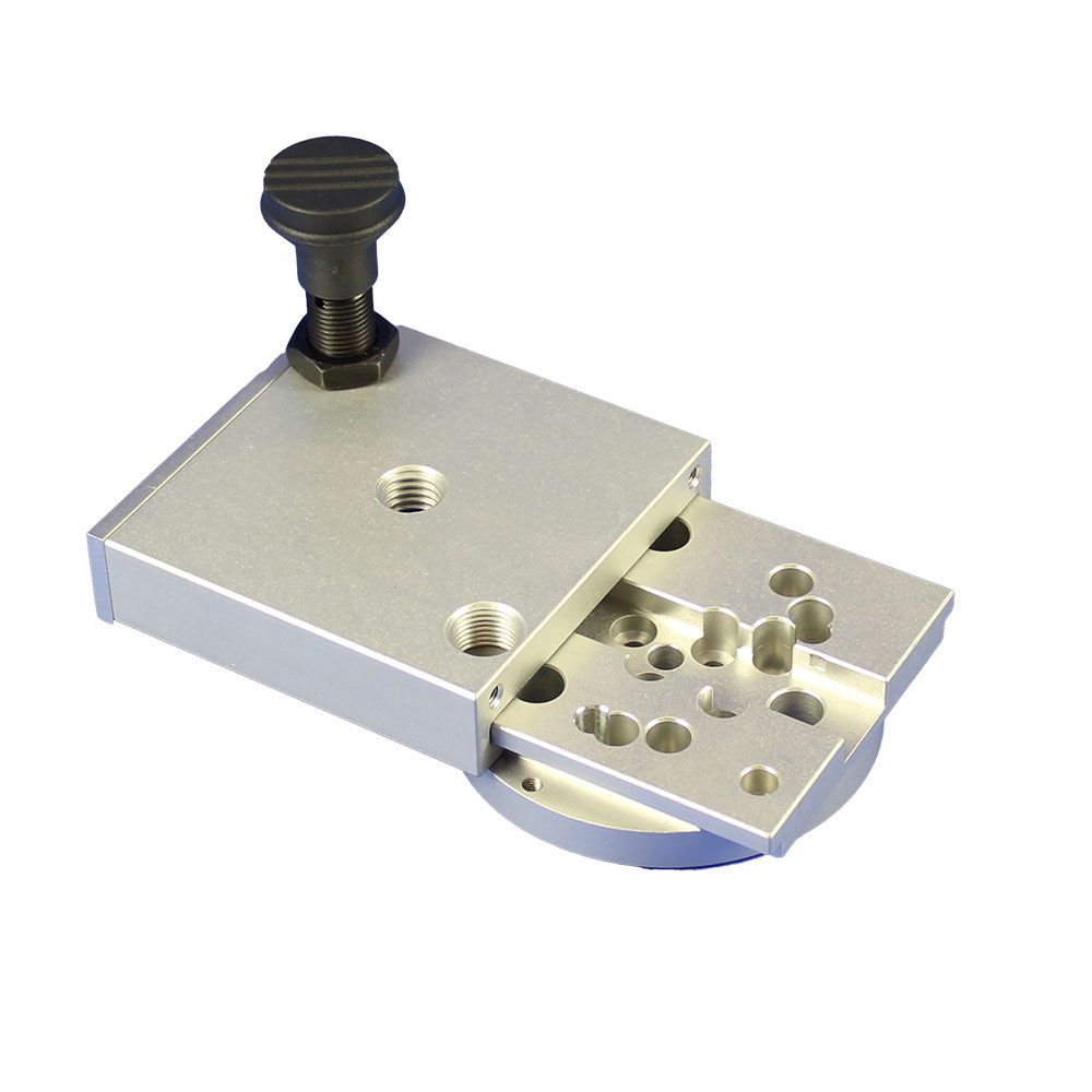 Two pieces of metal with holes in them on a white background