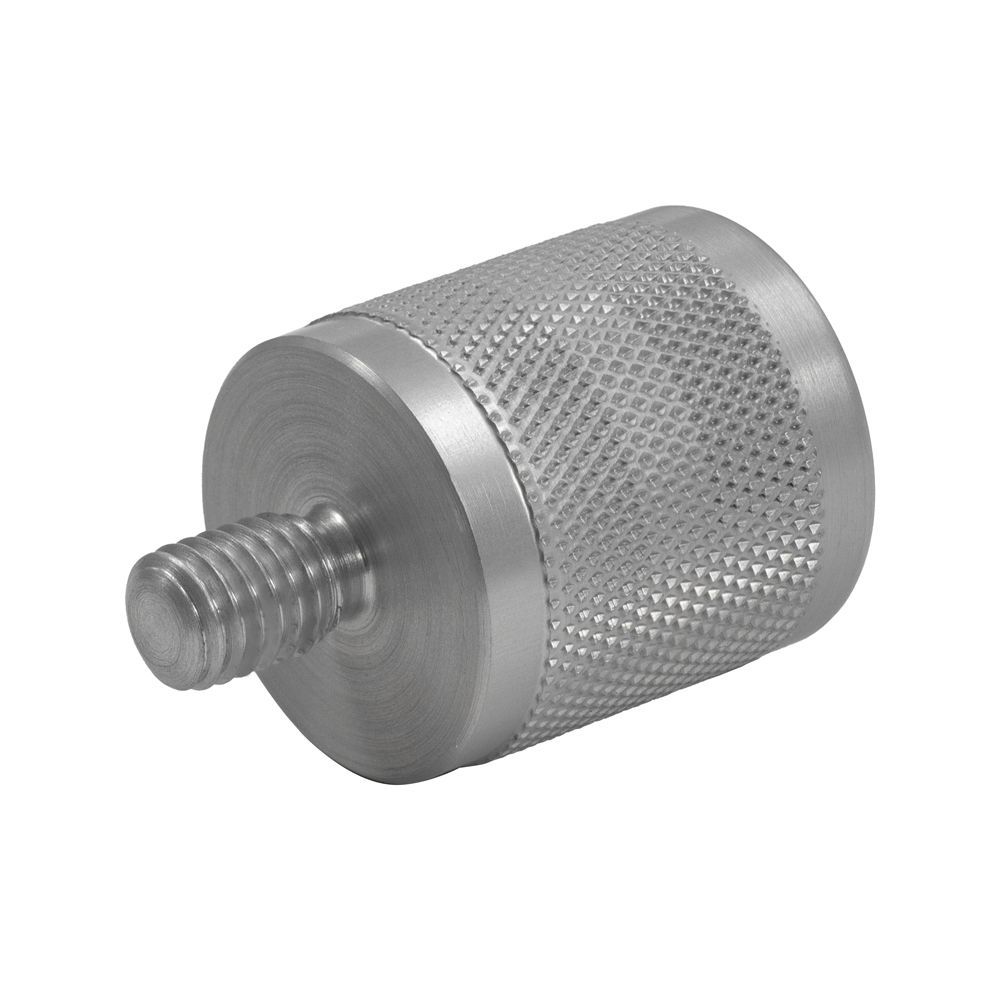 A metal cylinder with a hole in the middle on a white background