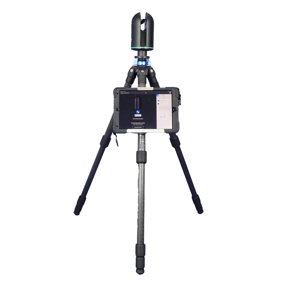 A camera on a tripod with a phone attached to it